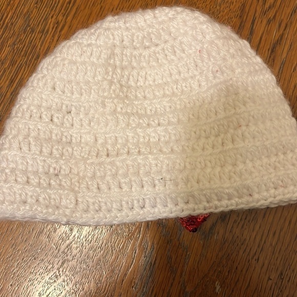 White crocheted hat with red glitter bow. Infant size 6-12mo. - Picture 2 of 4